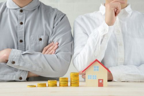 Man and woman talking about the division of non-marital and marital assets in divorce.